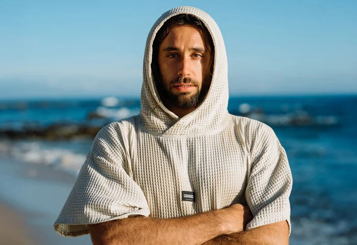 Load image into Gallery viewer, Green Hat Kiteboarding-Product-Mystic Poncho Waffle-Live Shot-Man Wearing  Waffle Poncho on the Beach

