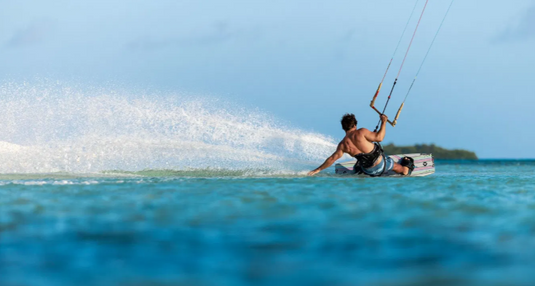 Green Hat Kiteboarding-2026 Duotone Jaime Concept Blue-Action Shot-Man Kiteboarding on the Jaime Concept Blue