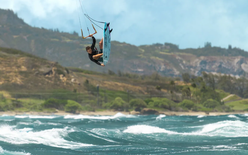 Load image into Gallery viewer, Green Hat Kiteboarding-2026 Duotone Traction Pad d/Lab Front-Action Shot-Man In Air While Kitesurfing
