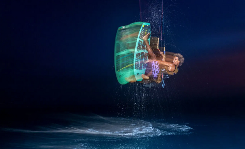 Load image into Gallery viewer, Green Hat Kiteboarding-2026 Duotone Traction Pad SLS Front-Action Shot-Man in the Air Kitesurfing
