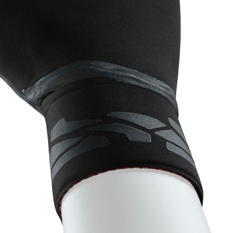 Load image into Gallery viewer, Close-up of an Ion black glove with textured wrist cuff on a white background
