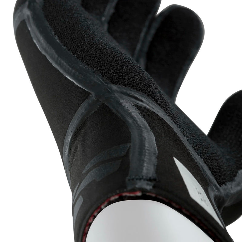 Load image into Gallery viewer, Close-up of an Ion black glove with textured palm on a white background
