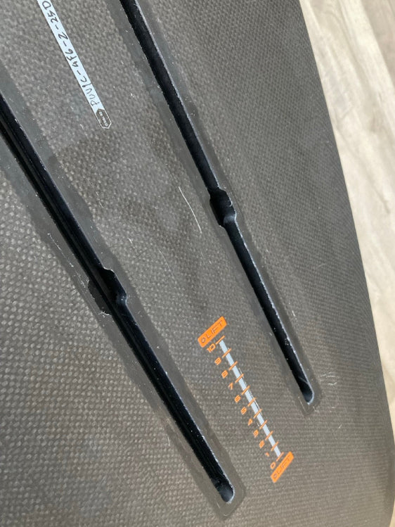 Load image into Gallery viewer, Green Hat Kiteboarding-4&#39;6 Ozone Pulse V1 Carbon Foilboard USED-Close Up View of Foil Track on a Wooden Background
