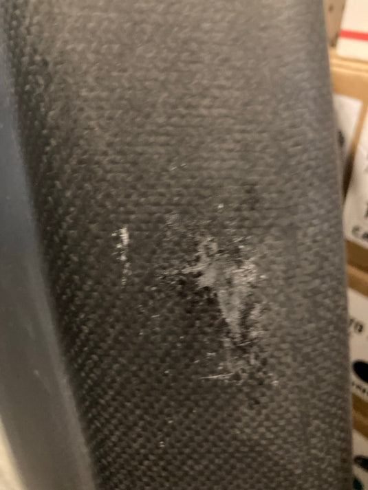 Green Hat Kiteboarding-4'6 Ozone Pulse V1 Carbon Foilboard USED-Close Up View of Edge Scrapes on a Wooden Background