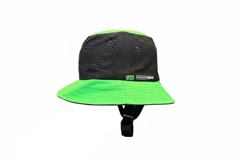 Load image into Gallery viewer, Black and green helmet with a visible brand logo on a wooden surface.
