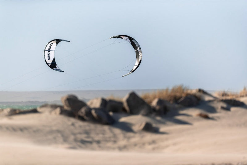 Load image into Gallery viewer, Flying the Core XR7 7m Kiteboarding Kite in the sky, enjoying the windsports and extreme sport of kite surfing.
