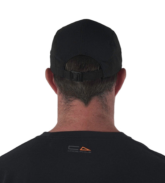 Green Hat Kiteboarding-Code Foils Cap-Man Looking Back Wearing Code Cap on a White Background