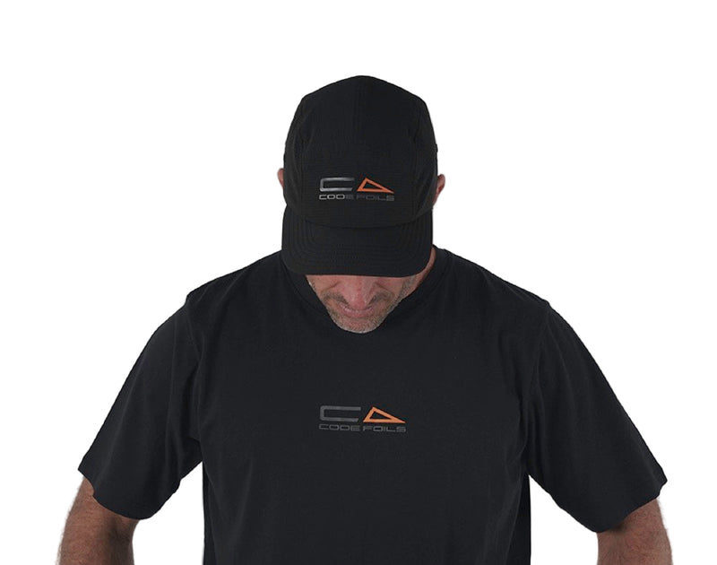 Load image into Gallery viewer, Green Hat Kiteboarding-Code Foils Cap-Man Looking Down Wearing Code Cap on a White Background
