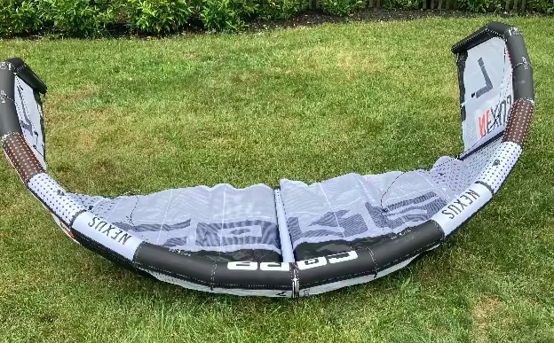 Load image into Gallery viewer, Green Hat Kiteboarding-Core Nexus 4 7m Kite USED-Right Side Up Leading Edge View on Grass
