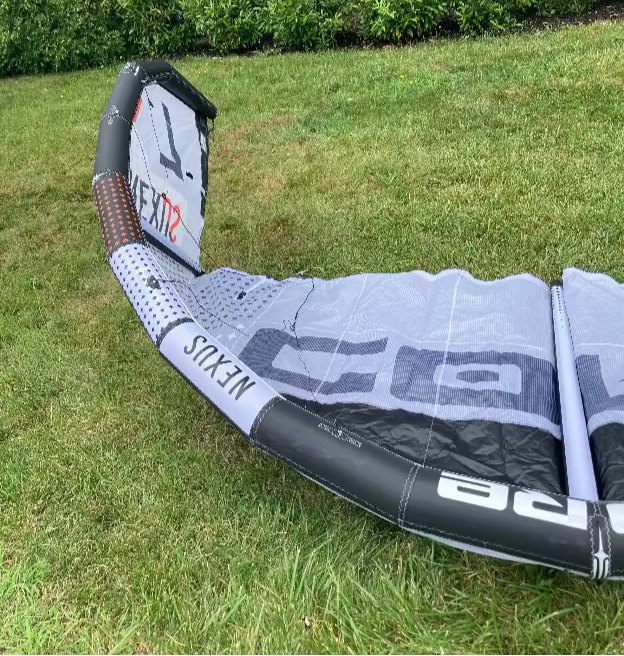 Load image into Gallery viewer, Green Hat Kiteboarding-Core Nexus 4 7m Kite USED-Inside Right Wing Tip View on Grass
