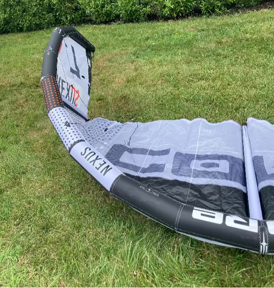Green Hat Kiteboarding-Core Nexus 4 7m Kite USED-Inside Right Wing Tip View on Grass