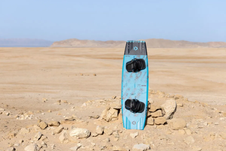 Load image into Gallery viewer, Green Hat Kiteboarding-Duotone Big Air SLS Kiteboard-Live Shot-Board Standing in the Desert
