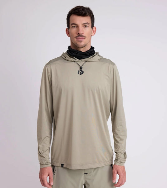 Man wearing a dusty forest long-sleeve hoodie with a Duotone brand logo on a white background