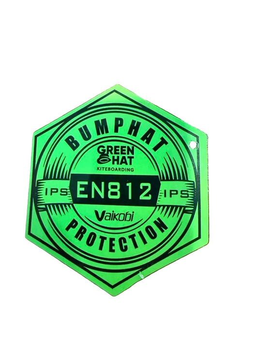 Hexagonal green and black label on a white surface