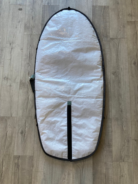 Green Hat Kiteboarding- ION Wing Board Bag 4'9 USED-Bottom View on a Wooden Surface