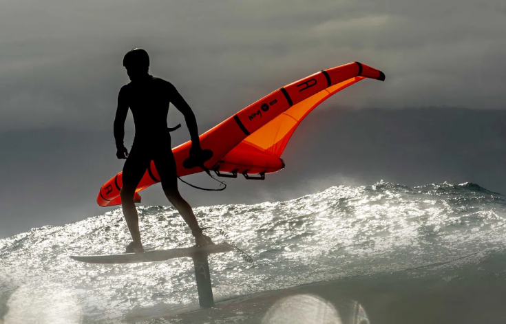 Load image into Gallery viewer, Green Hat Kiteboarding-Kt Foils Atlas FW-Action Shot-Man Wingfoiling on KT Gear

