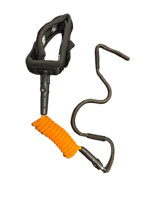 Leash with black handle and orange coiled body.