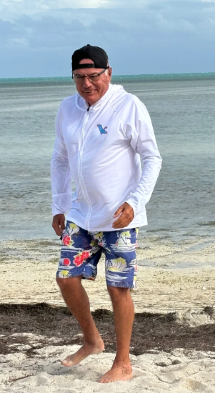 Load image into Gallery viewer, Green Hat Kiteboarding-Kite Kulture White long-sleeve jacket-Live Shot-Man on a beach Wearing the Jacket

