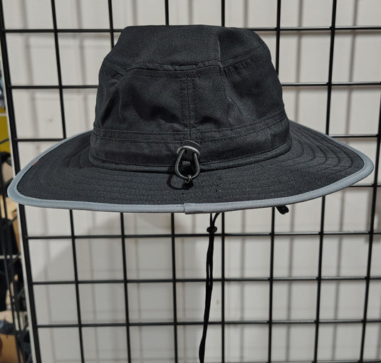 Green Hat Kiteboarding-Lift Foils Bucket Hat-Rear View of Black bucket hat with a logo patch on a grid background
