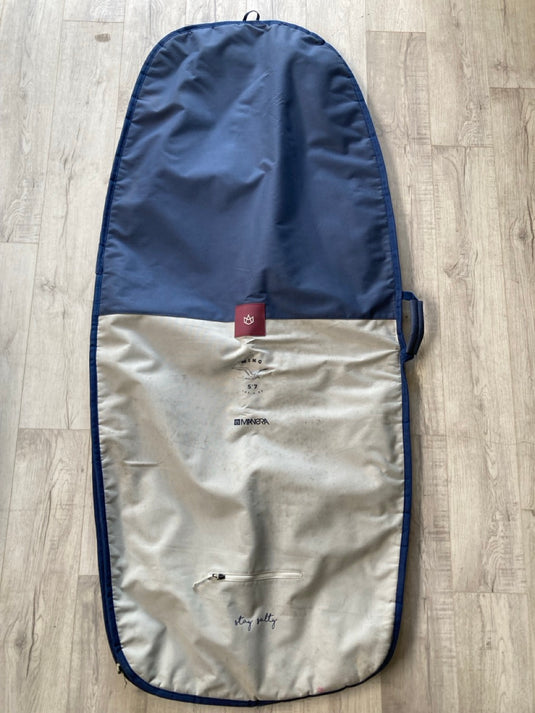 Green Hat Kiteboarding-Manera5'7 Wing Board Bag-USED-Top View on a Wooden Surface
