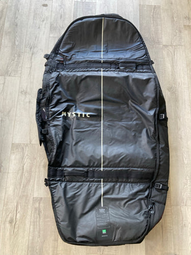 Green Hat Kiteboarding-Mystic 5'1 Saga Foil Board Bag USED-Top View of the Bag on a Wooden Background