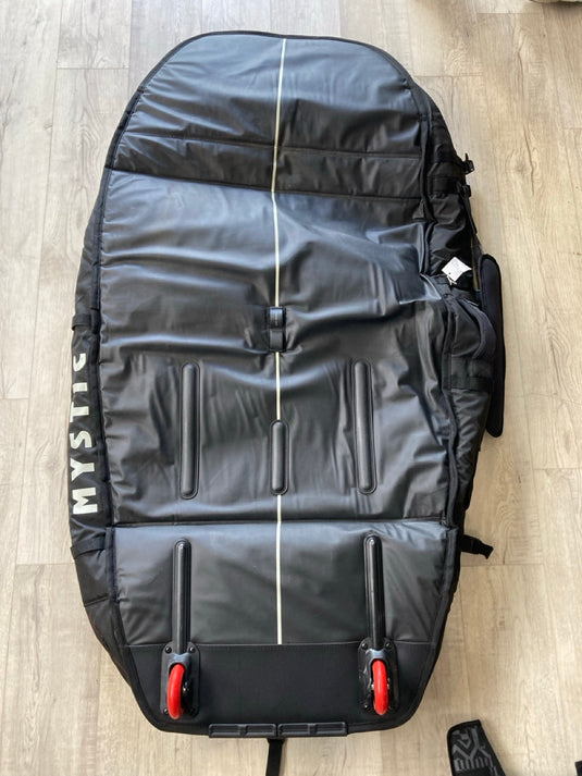 Green Hat Kiteboarding-Mystic 5'1 Saga Foil Board Bag USED-Bottom View of the Bag on a Wooden Background