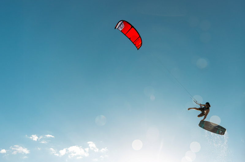 Load image into Gallery viewer, Green Hat Kiteboarding-2026 Ozone Edge VT-Live Shot-Man in the Air Lying an Edge VT
