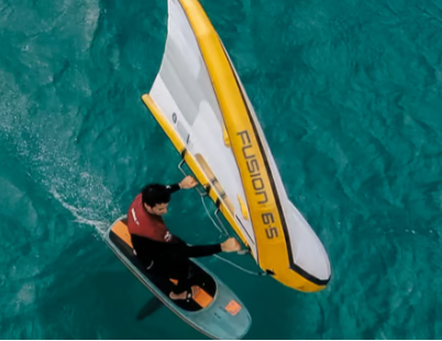 Green Hat Kiteboarding-Ozone Fusion V2 Ultra-X Wing-Action Shot-Man Wing Foiling on White Fusion V2 Wing