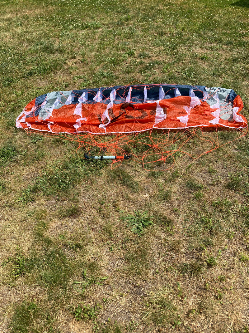 Load image into Gallery viewer, Rear bottom side view of para wing, bar, and lines. 
