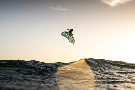 Green Hat Kiteboarding-2026 Duotone Unit D/Lab Wing-Action Shot-Person jumping  a Wave on the 2026 Unit D/Lab