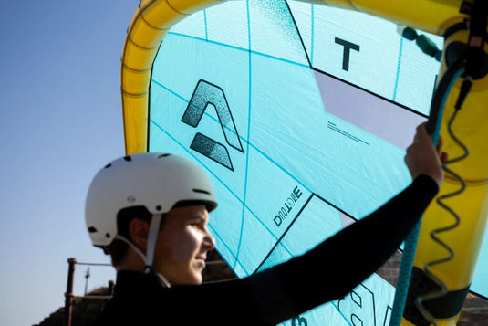 Green Hat Kiteboarding-2026 Duotone Unit D/Lab Wing-Live Shot-Close Up View of Canopy-Man Holding the Duotone Unit D/Lab