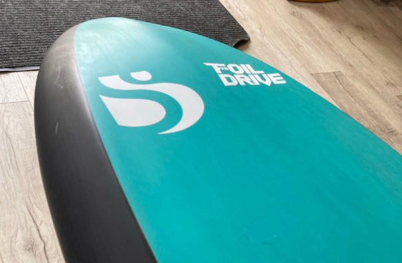 Load image into Gallery viewer, Green Hat Kiteboarding-Sunova X 4&#39;8 Foil Drive Foilboard USED-Close Up View of Scratches on Bottom Edge of the Board
