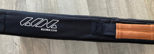 Green Hat Kiteboarding-Takuma Foil Carrying Case-Profile View on a Wooden Surface