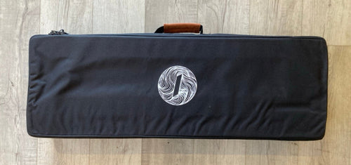 Green Hat Kiteboarding Takuma Mast Carrying Case USED-Top View on Wooden Surface