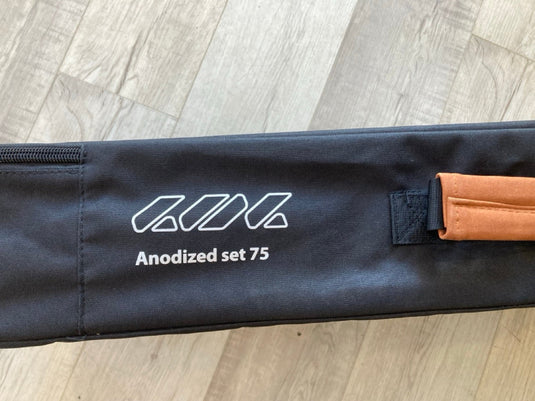Green Hat Kiteboarding Takuma Mast Carrying Case USED-Profile View on Wooden Surface