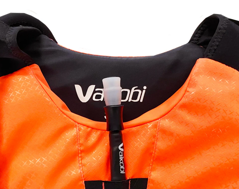 Load image into Gallery viewer, Green Hat Kiteboarding-Vaikobi Hydration Bladder Hose in Front of PDF Vest on a White Background
