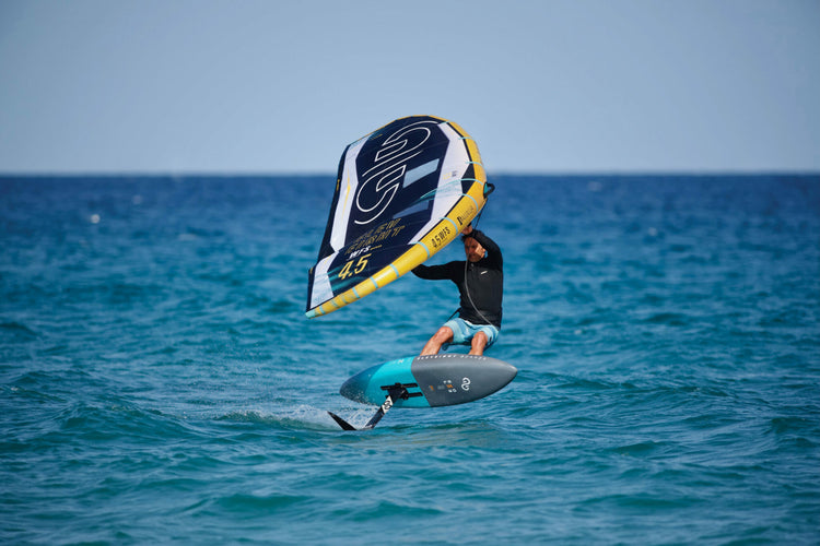 Green Hat Kiteboarding-Main Page Slideshow-Man Wing foiling on Eleveight gear