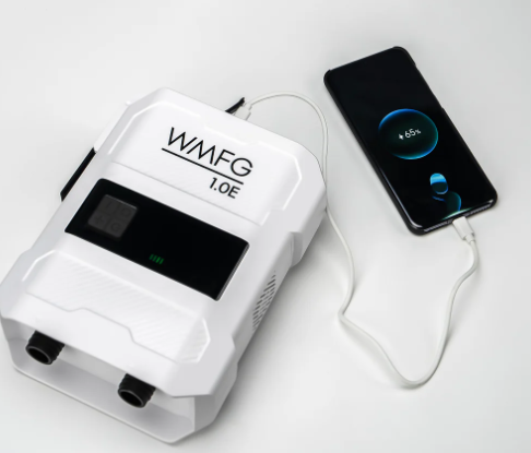 Green Hat Kiteboarding-WMFG 1.0 Electric Kite/Wing/SUP Pump-WMFG Pump connected to a smartphone on a white background