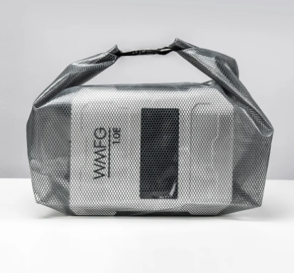 Green Hat Kiteboarding-WMFG 1.0 Electric Kite/Wing/SUP Pump-Silver mesh bag with Pump inside on a gray background