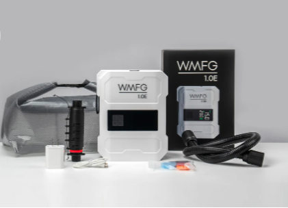 Green Hat Kiteboarding-WMFG 1.0 Electric Kite/Wing/SUP Pump-WMFG Pump and accessories on a white surface with a gray background
