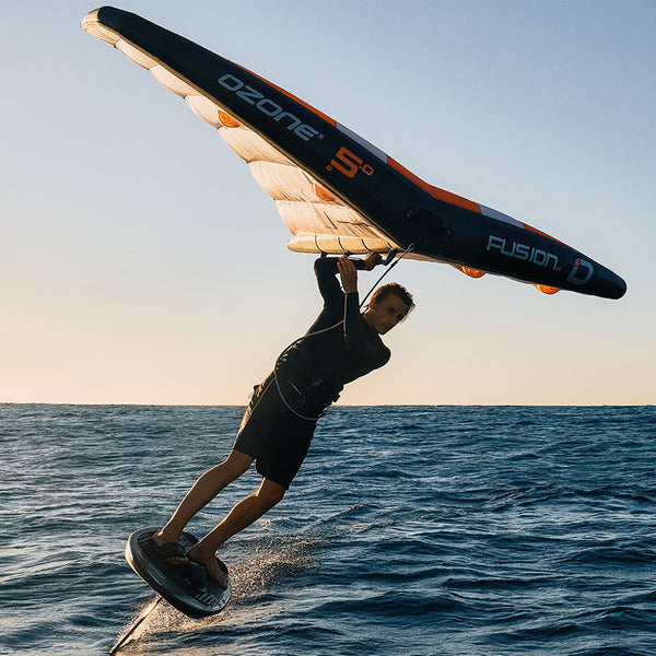 A man flying on the Ozone Fusion V1 Foil Wing over water.