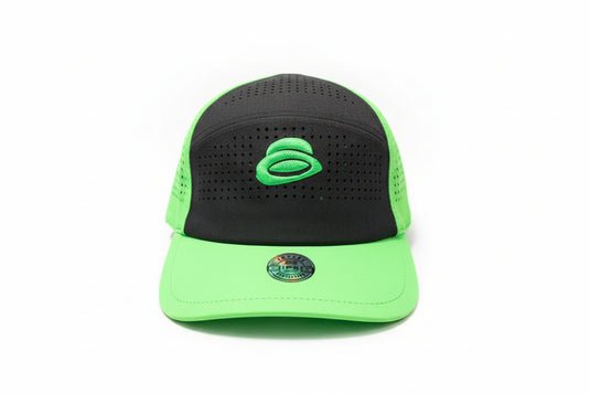 Green and black hat with a brand logo on a white surface